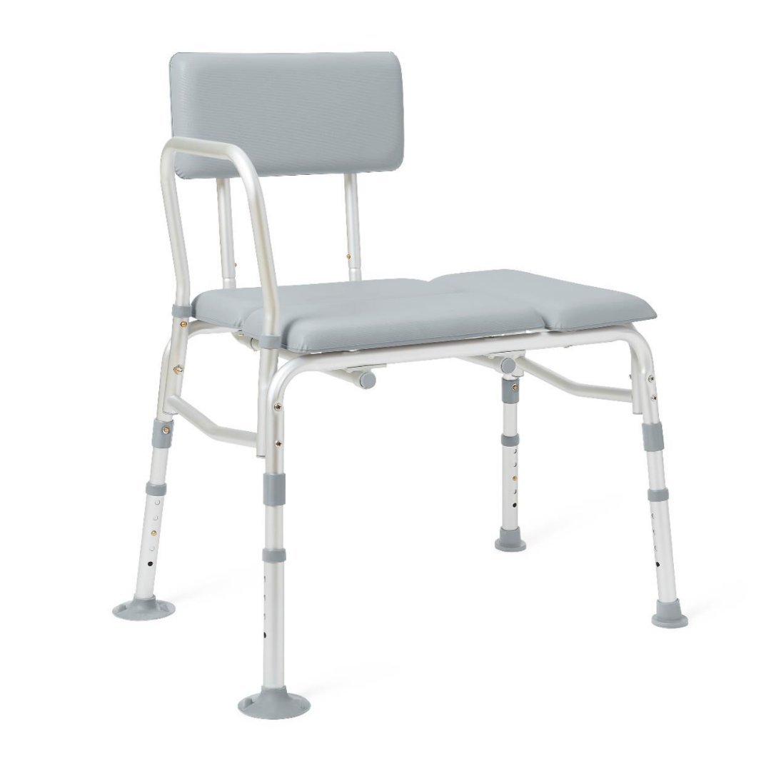 The Medline Bariatric Padded Bathtub Transfer Bench is a light gray, adjustable-height shower seat with a backrest, one armrest, padded seat, sturdy adjustable legs, and large rubber feet for stability.